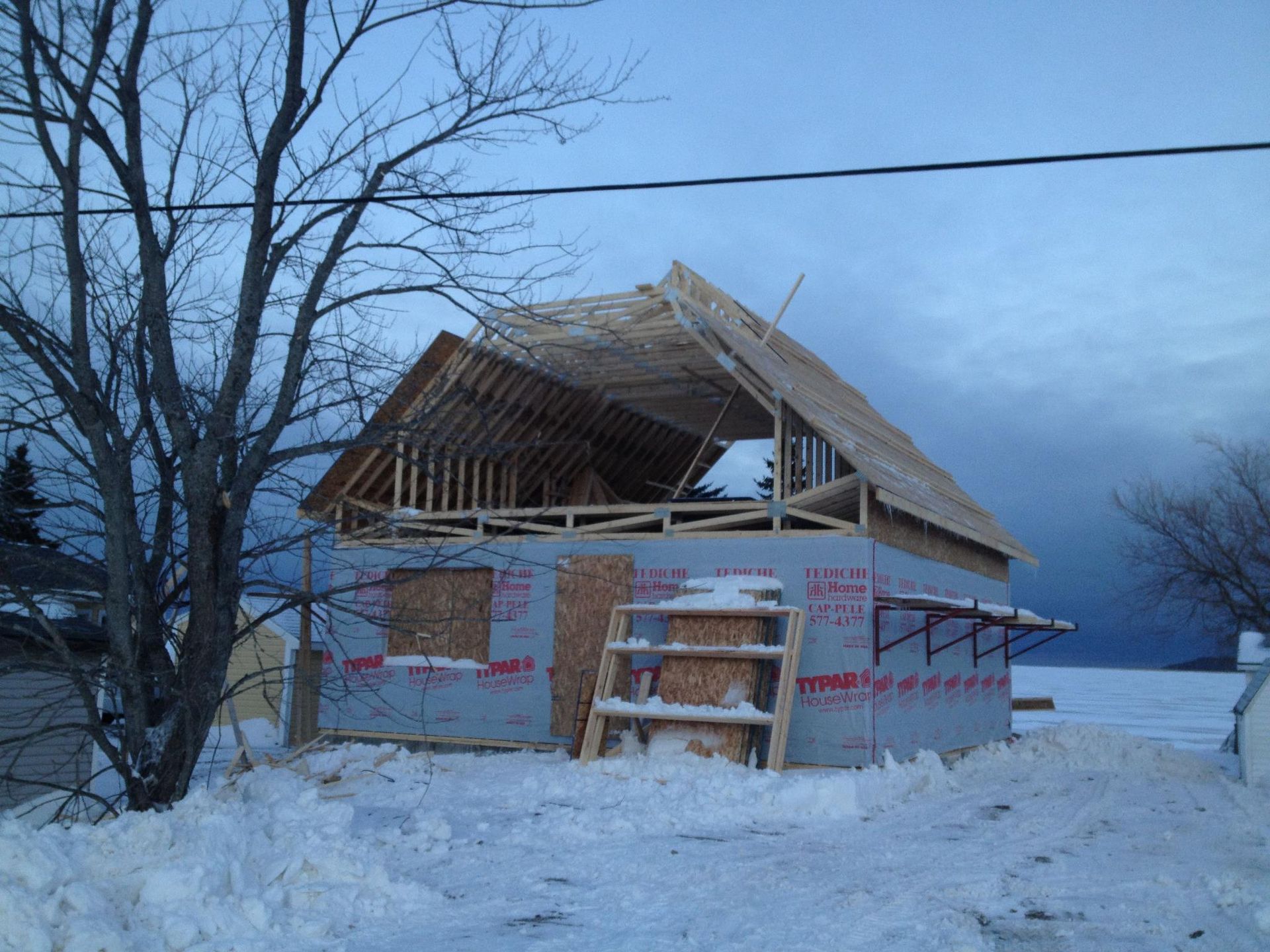 A house that is being built in the snow