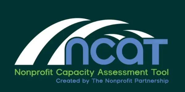 Logo for the Nonprofit Capacity Assessment Tool (NCAT), featuring blue text on a dark green background.