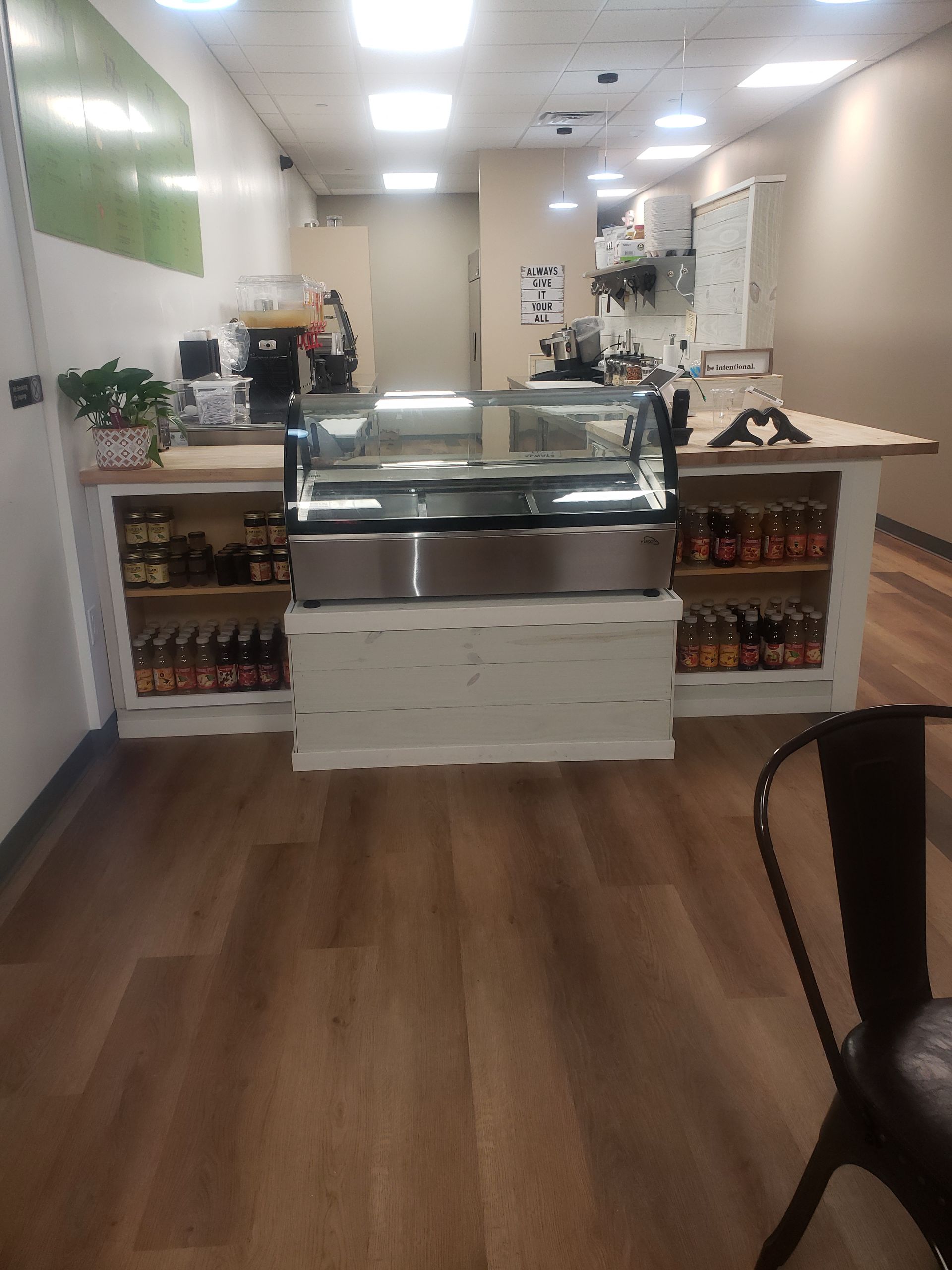 There is a display case in the middle of the room.