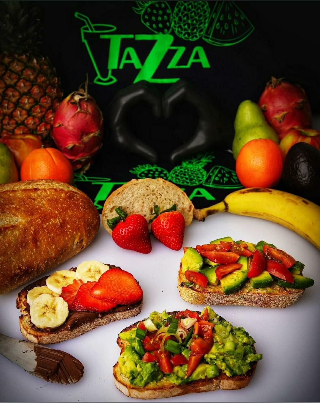 A variety of sandwiches are on a table with a sign that says jazza