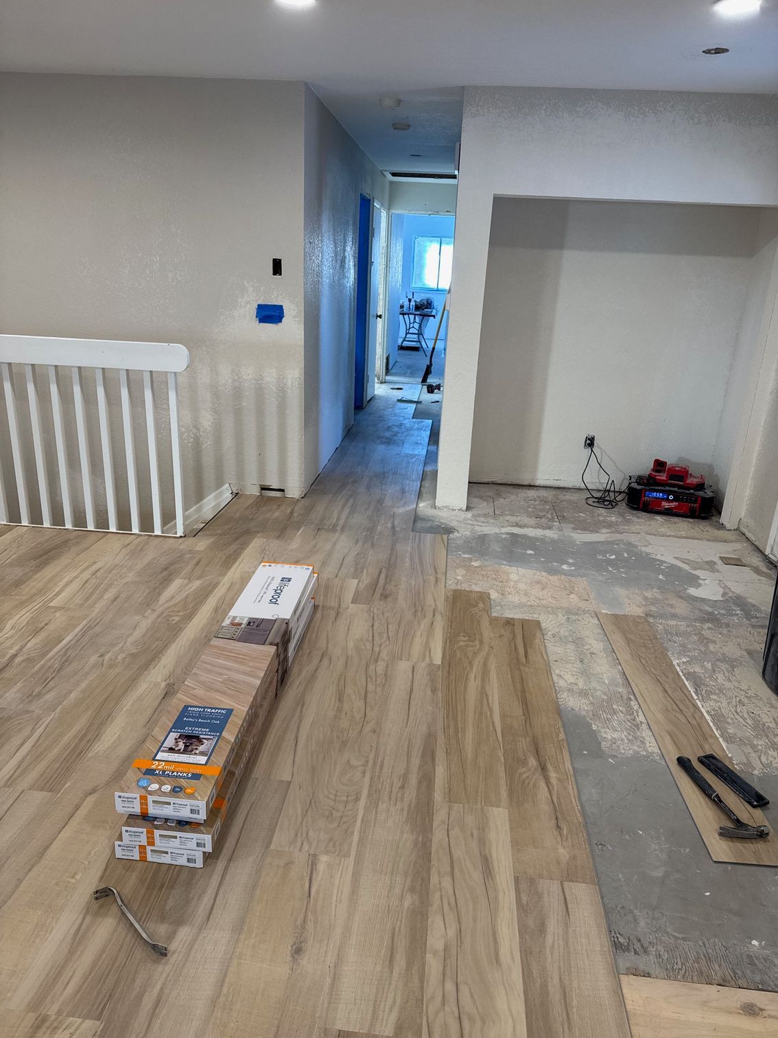 An empty building under construction with concrete pillars and a window.