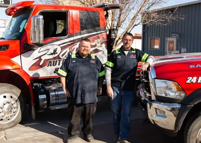 Our team standing by towing trucks reading for service in Hastings, NE | Pat's Auto Repair & Towing