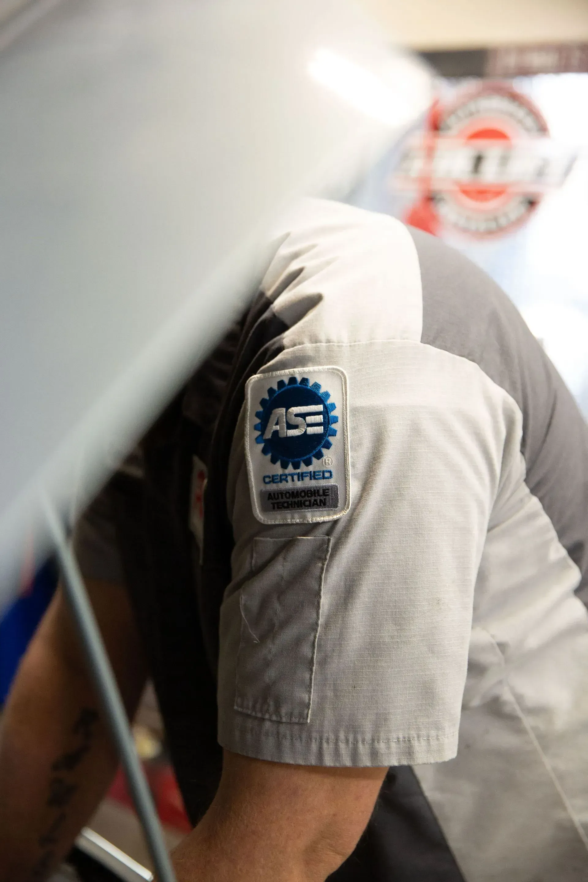 Technician with ASE Certified patch on sleeve | Pat's Auto Repair & Towing