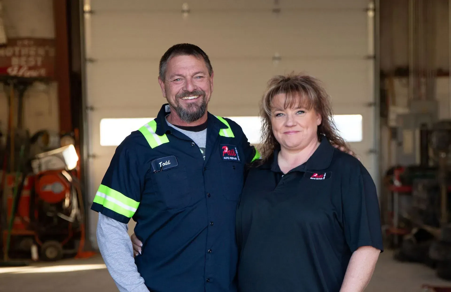 Team standing in garage | Pat's Auto Repair & Towing