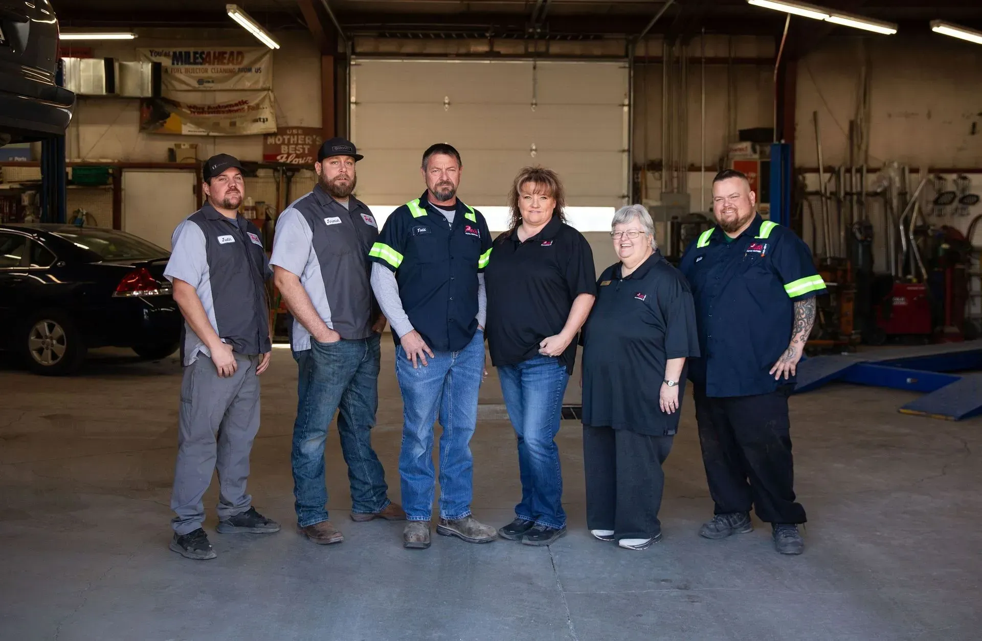 Our team standing in our garage | Pat's Auto Repair & Towing