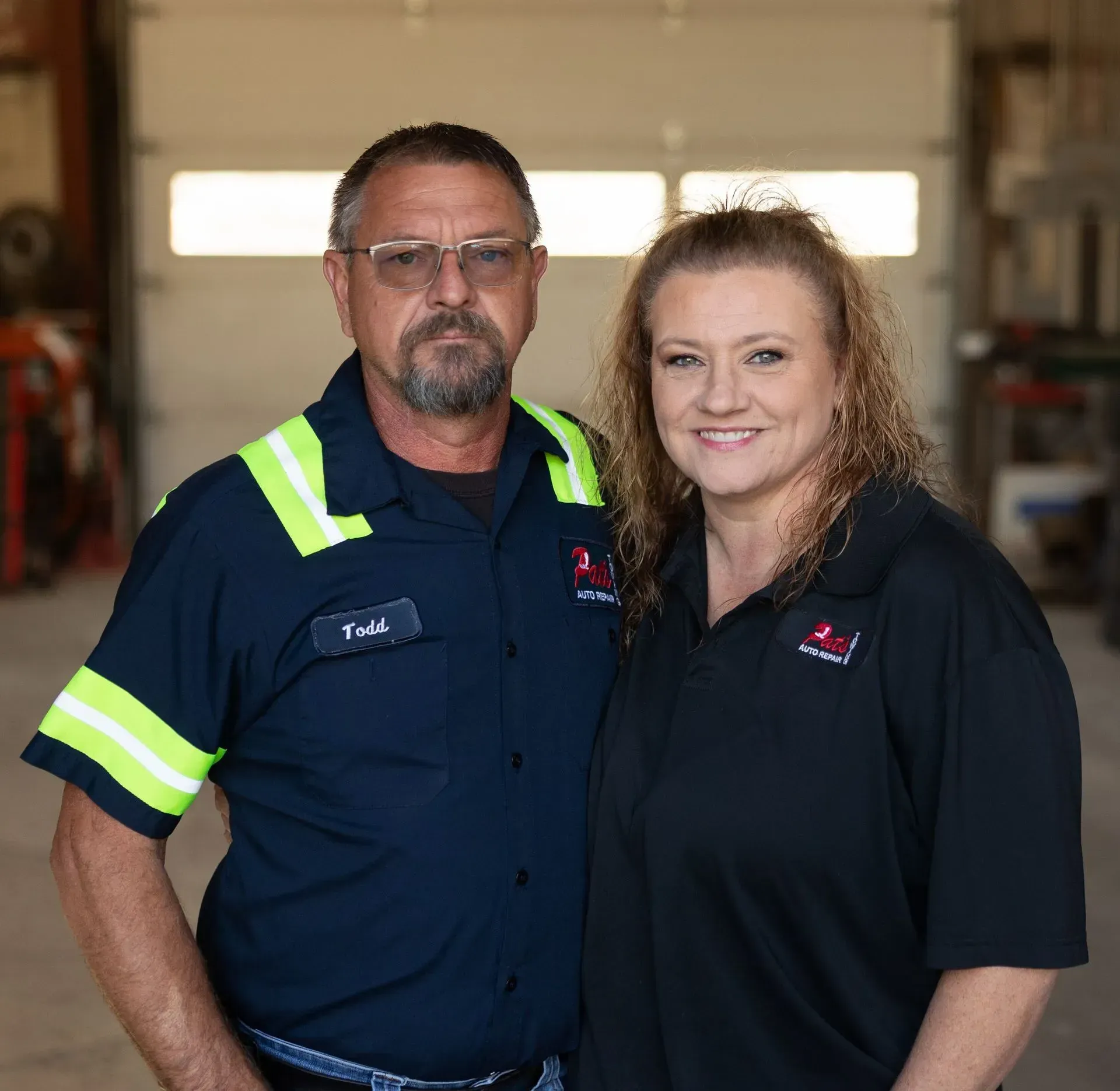 Owner and Tow Manager standing in garage | Pat's Auto Repair & Towing