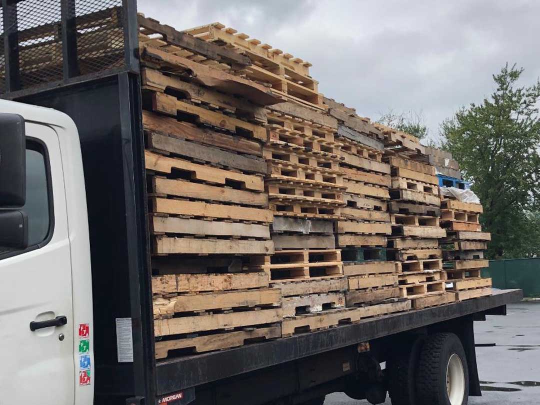 Surplus pallets loaded onto a flatbed truck