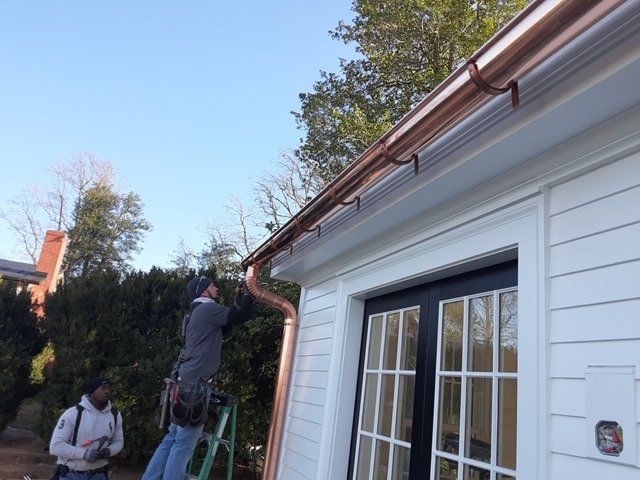 Men Repairing the Gutter — Charlottesville, VA — Straightedge Inc.