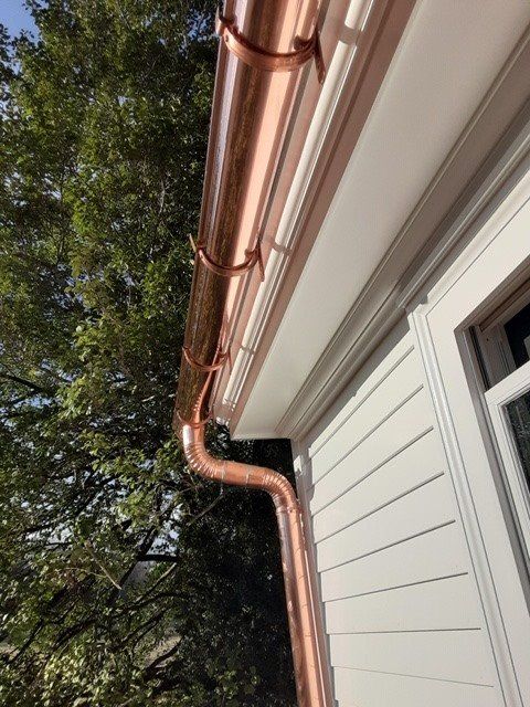 Men Installing New Gutter — Charlottesville, VA — Straightedge Inc. Men Installing New Gutter — Charlottesville, VA — Straightedge Inc