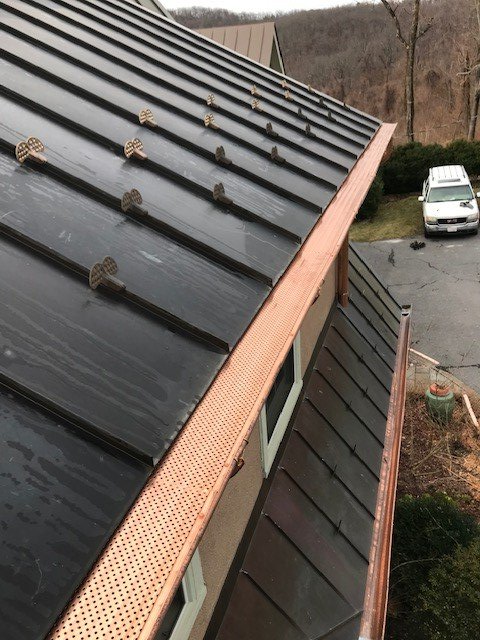 Men Checking the Downspout — Charlottesville, VA — Straightedge Inc. Men Checking the Downspout — Charlottesville, VA — Straightedge Inc.