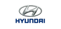 Hyundai logo with silver emblem above blue wordmark on white background