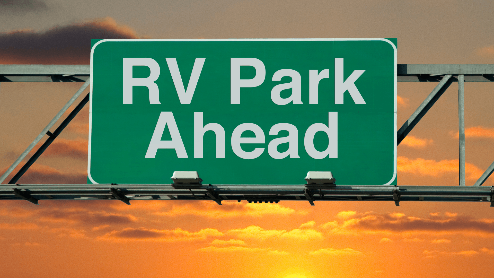 A green road sign that says