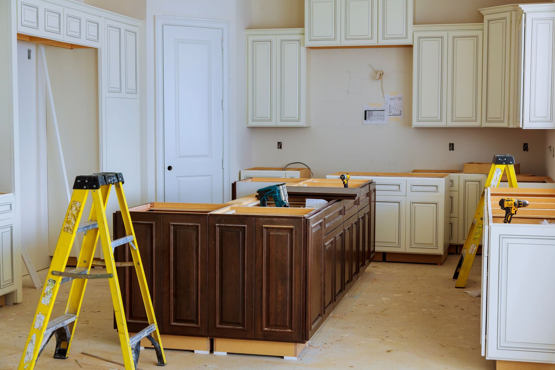 A kitchen is being remodeled with wooden cabinets and a yellow ladder.