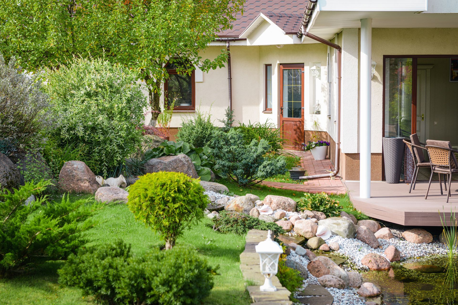 A cozy home surrounded by a beautifully landscaped garden and spacious yard.