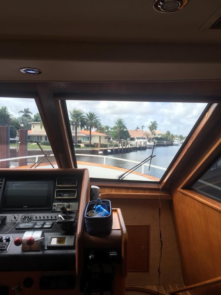 The inside of a boat with a view of the water