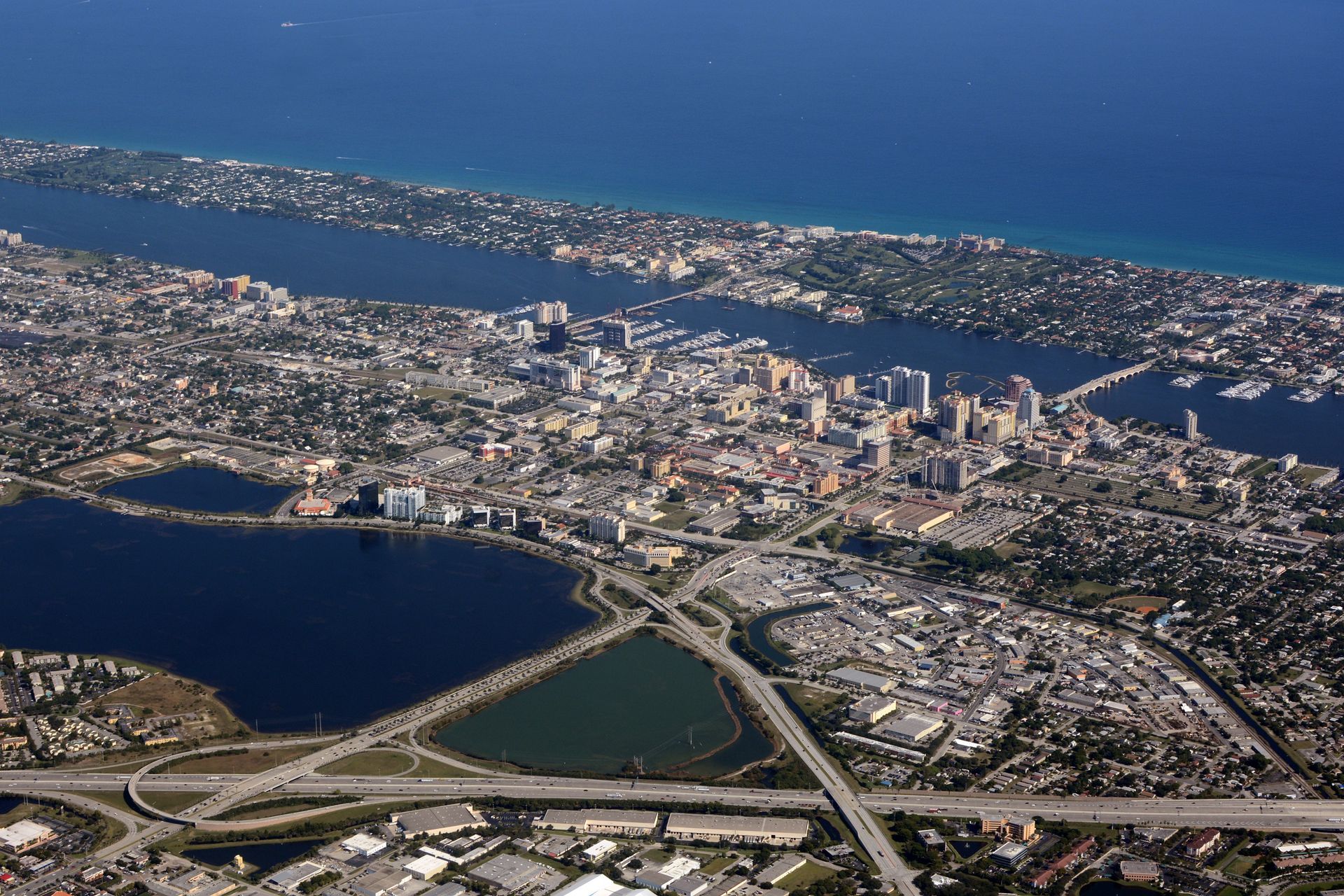 An aerial view of a city surrounded by water