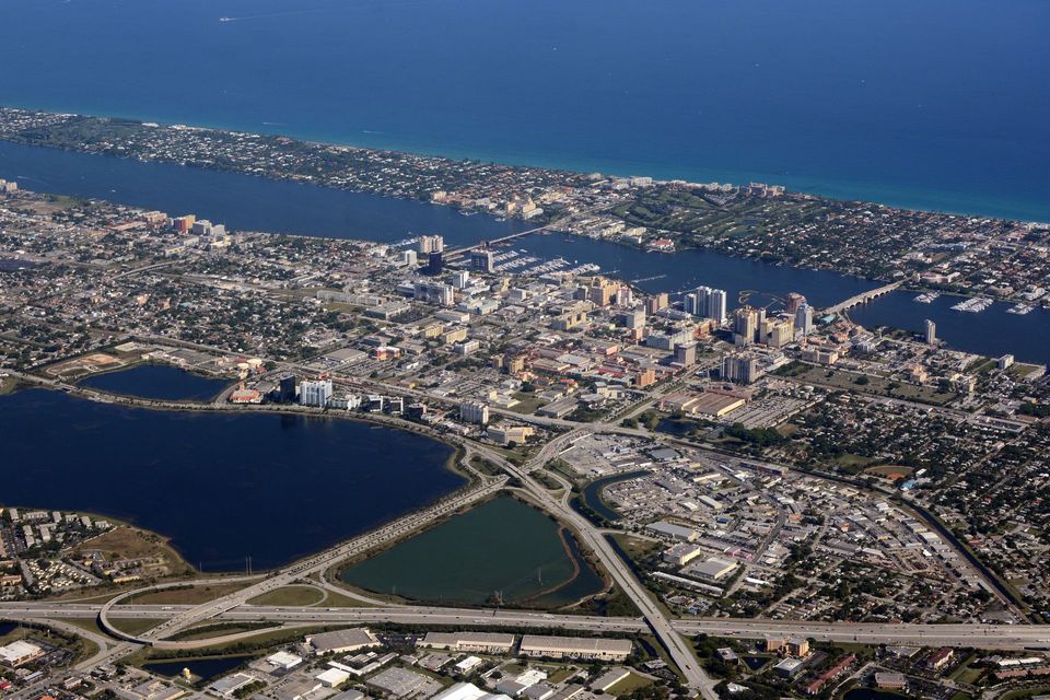 An aerial view of a city surrounded by water