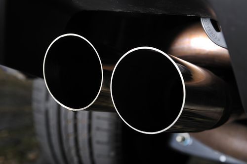 A Close Up of Two Exhaust Pipes on a Car — Marx Forster Tyres & Mechanical In Forster, NSW