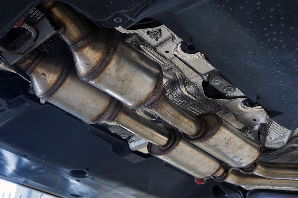 A Close Up of a Catalytic Converter on the Underside of a Car — Marx Forster Tyres & Mechanical In Forster, NSW