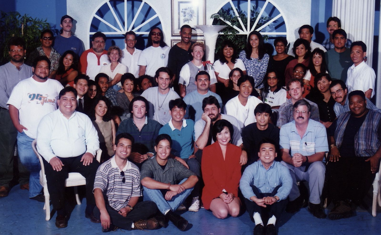 A group of people posing for a picture in front of a table