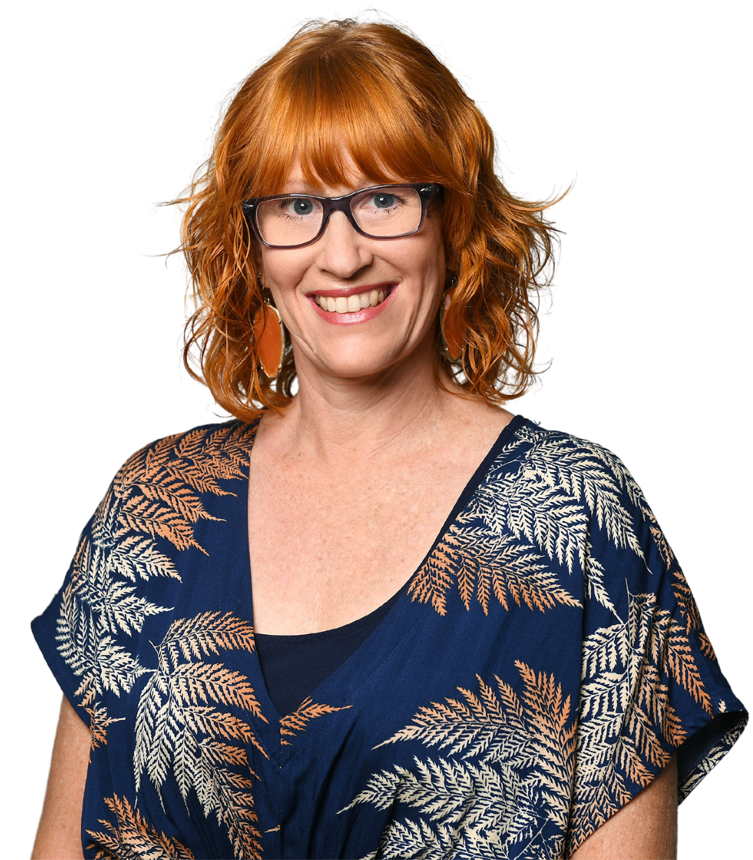 A woman with red hair wearing glasses and a blue shirt