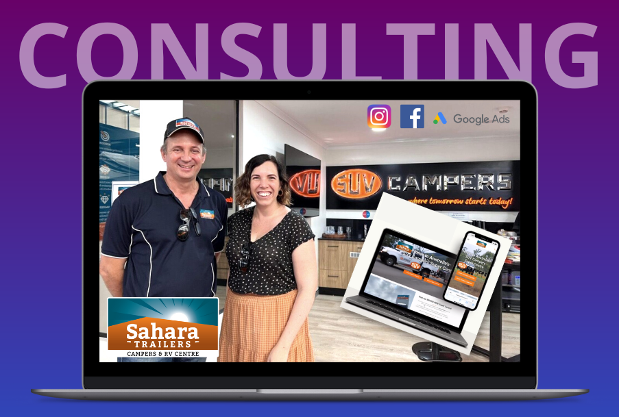 A man and a woman are standing in front of a laptop computer.