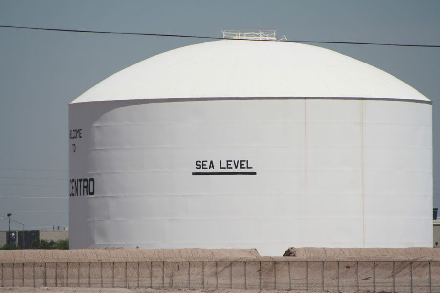 White storage tank labeled 