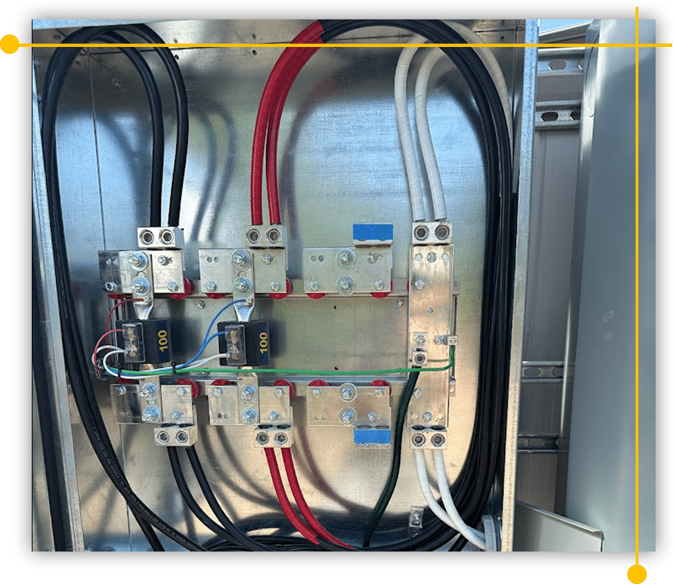 A metal box filled with electrical wires and connectors