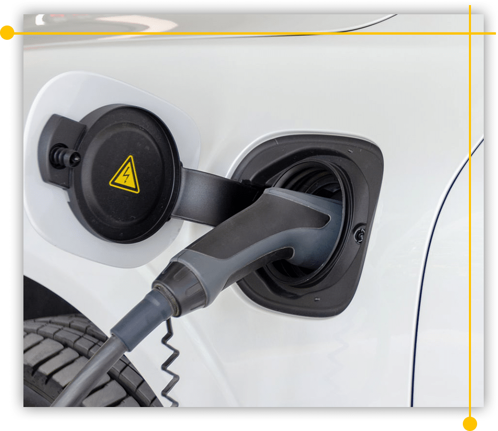 A close up of an electric car being charged