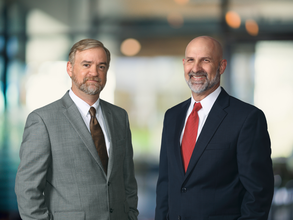 Personal injury attorneys Allen Ritchie and Jason Steele smiling.