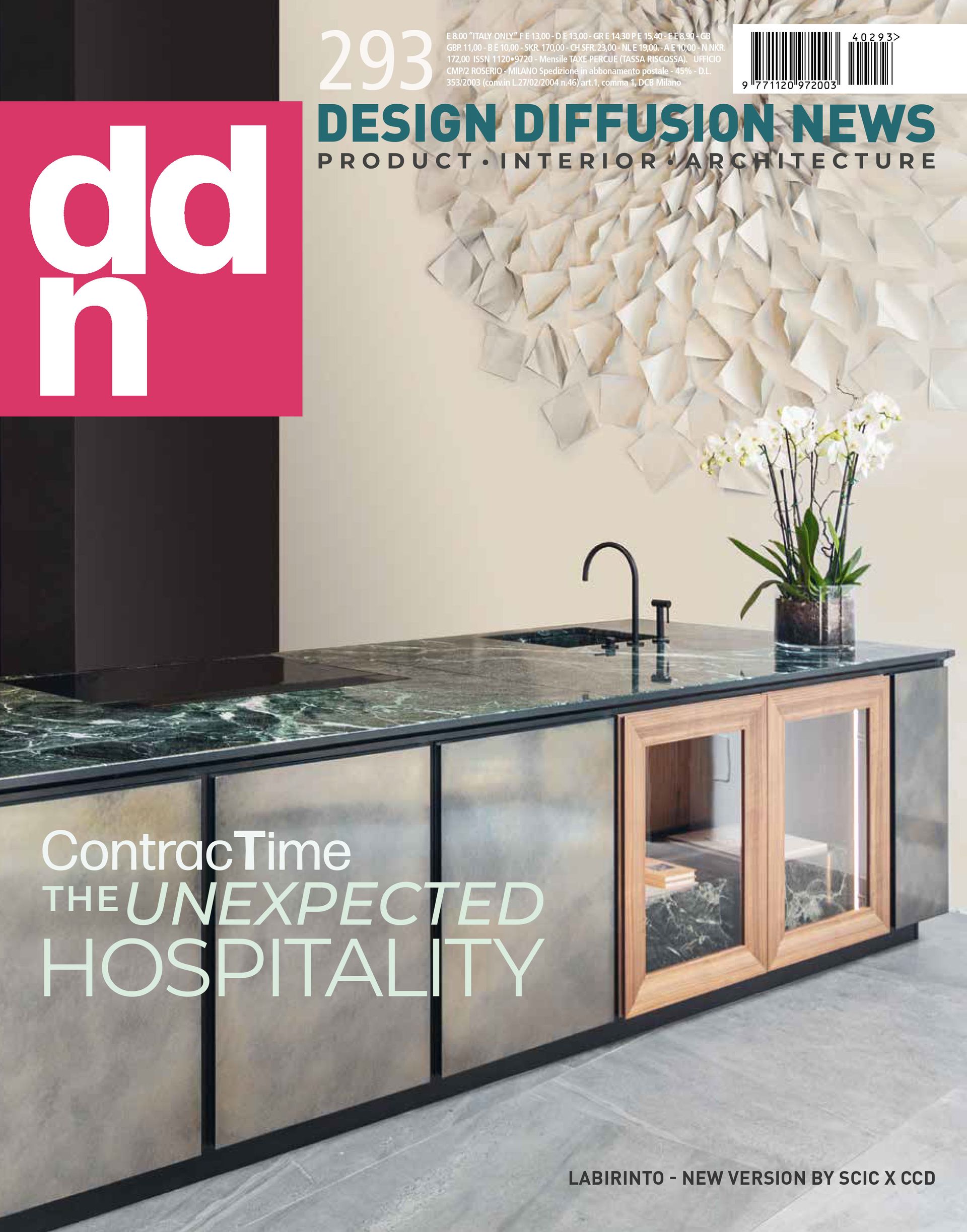 Cover of Design Diffusion News magazine featuring a modern kitchen island with a stone top and metal cabinets.