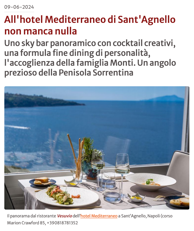 A table set for a fine dining meal at the Mediterraneo Hotel in Sant'Agnello, overlooking the ocean.