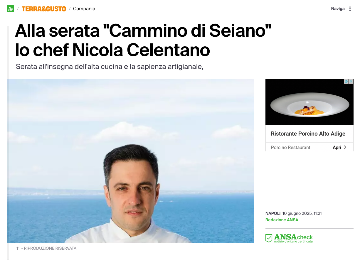Chef Nicola Celentano in a white uniform, with a blue sea in the background, in an article about the 