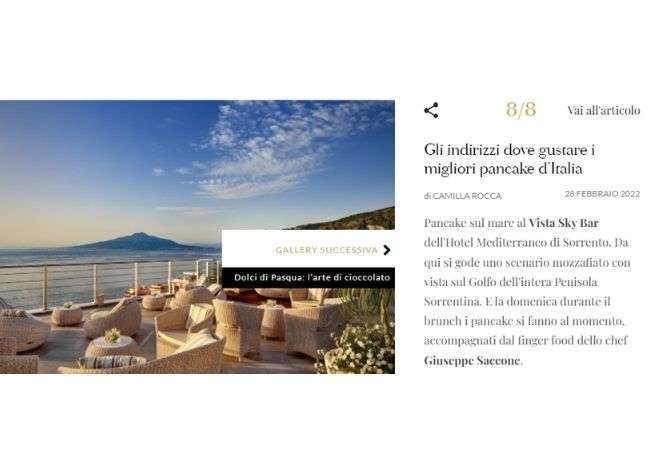 A rooftop bar in Sorrento overlooking the sea and Mount Vesuvius, next to an article about the best pancakes in Italy.