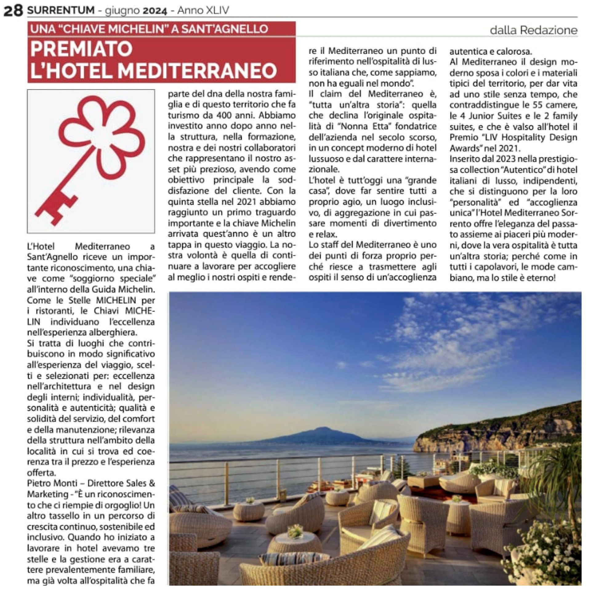 A newspaper article about Hotel Mediterraneo receiving a Michelin Key, with an image of its scenic terrace overlooking sea.