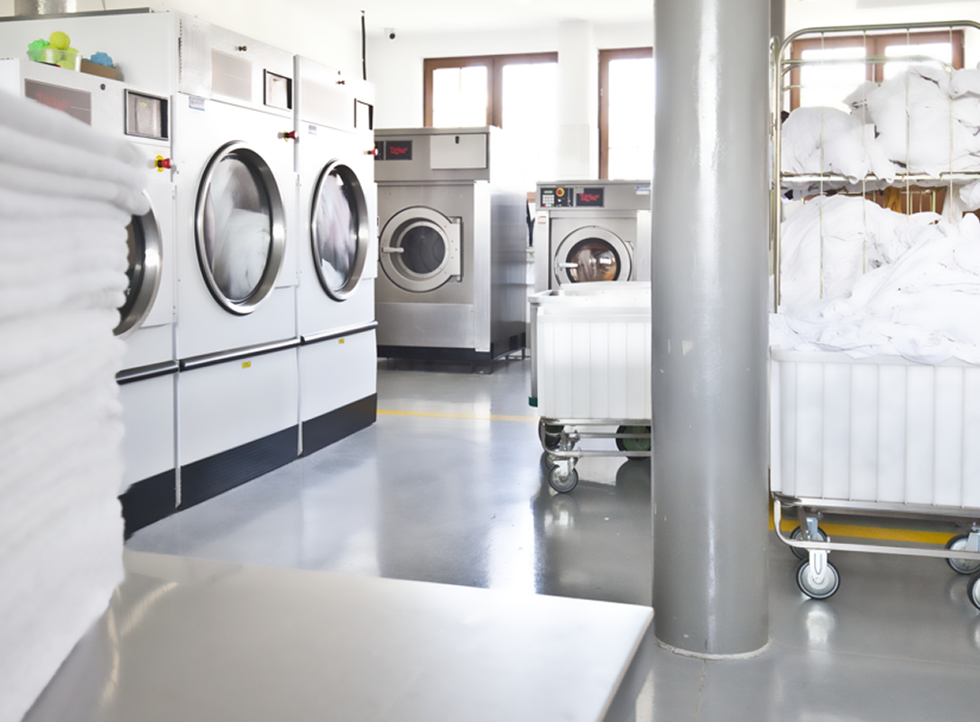 A laundromat with a lot of washers and dryers