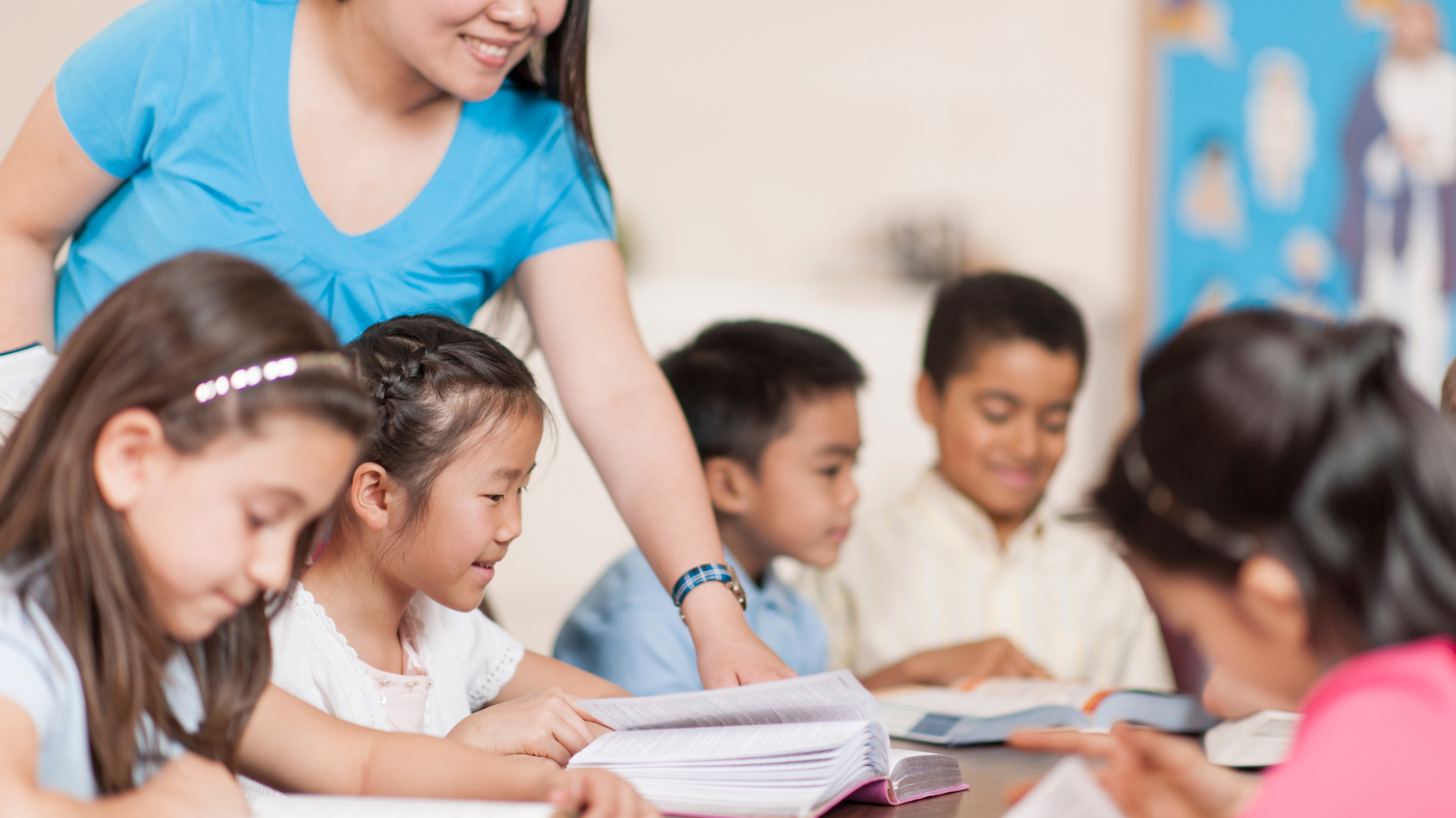 A gray and white house with stairs leading up to the second floor