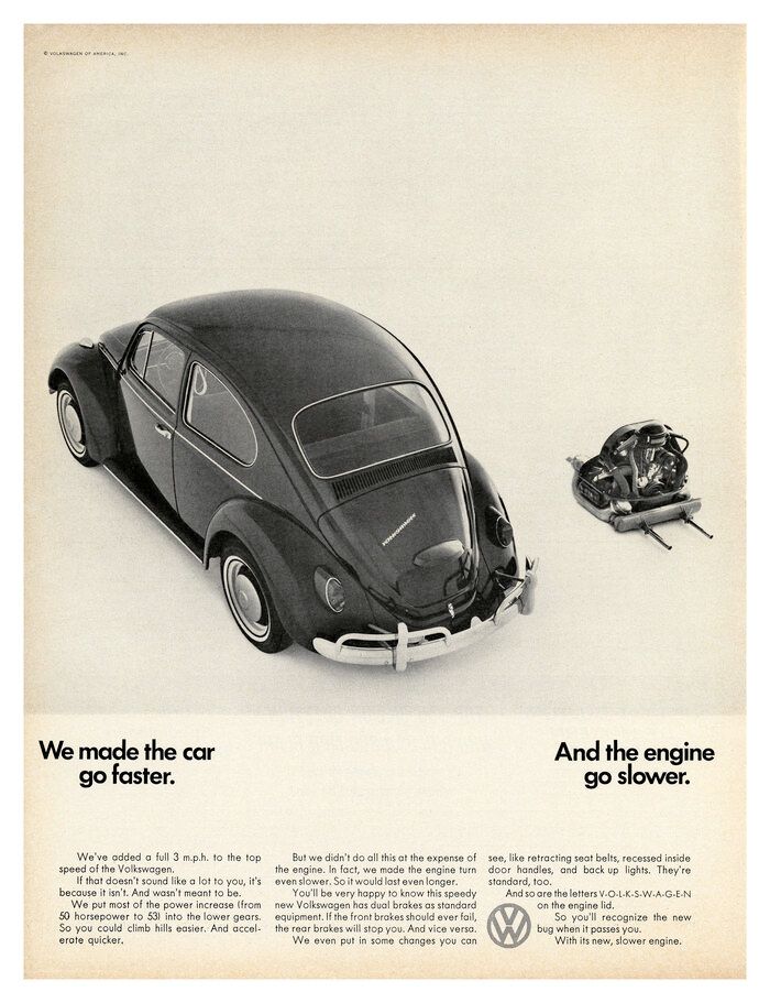 A black volkswagen beetle is shown in an advertisement.