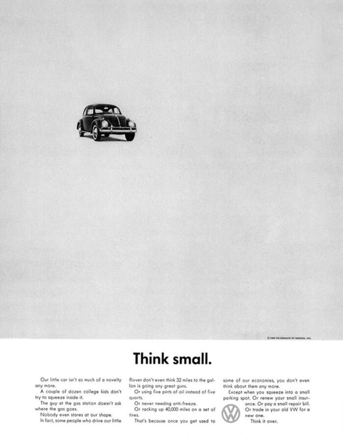 A black and white volkswagen ad that says think small