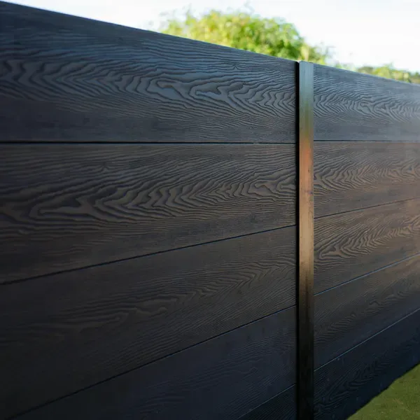 A stone wall with a blue sky in the background