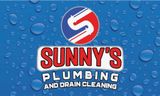 Logo for Sunny's Plumbing and Drain Cleaning. Red and white text on a blue background with water droplets.
