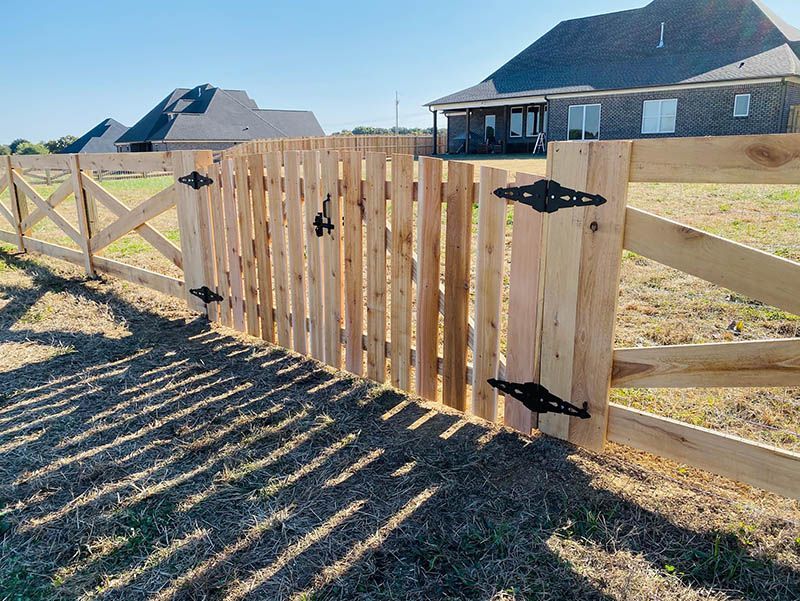 A blue tow truck is parked on the side of the road.
