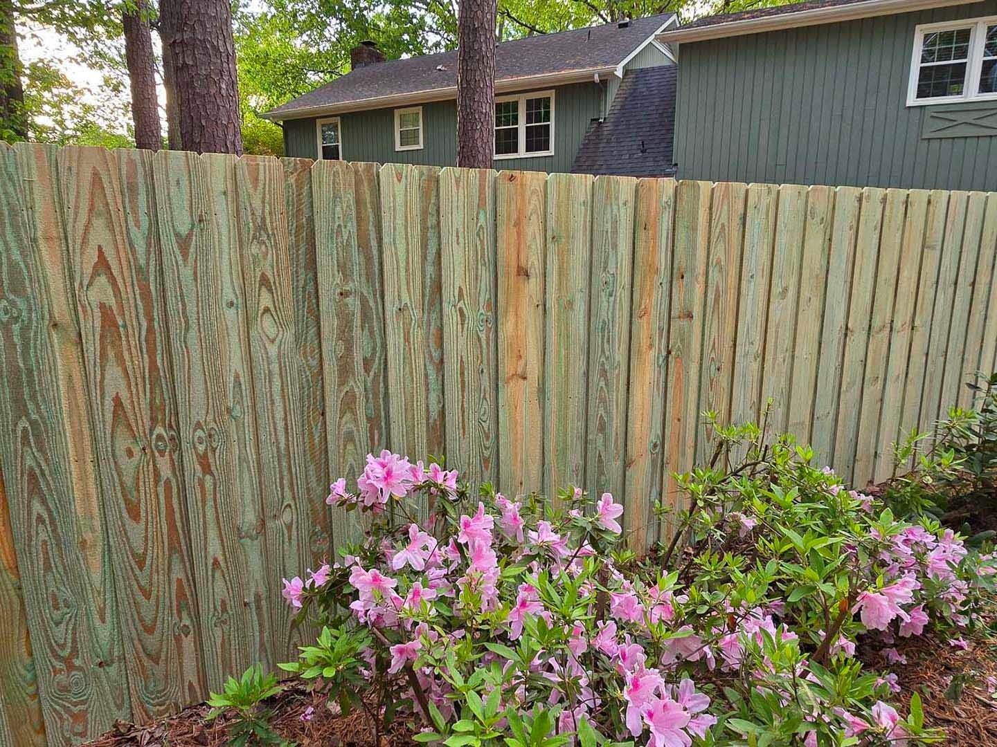A blue tow truck is parked on the side of the road.