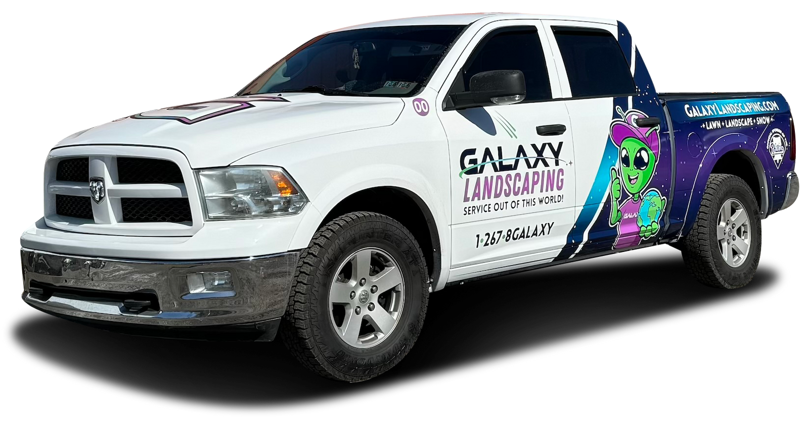 White Galaxy Landscaping pickup truck with logo and dragon graphic.