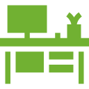 A green icon of a desk with a computer on it.