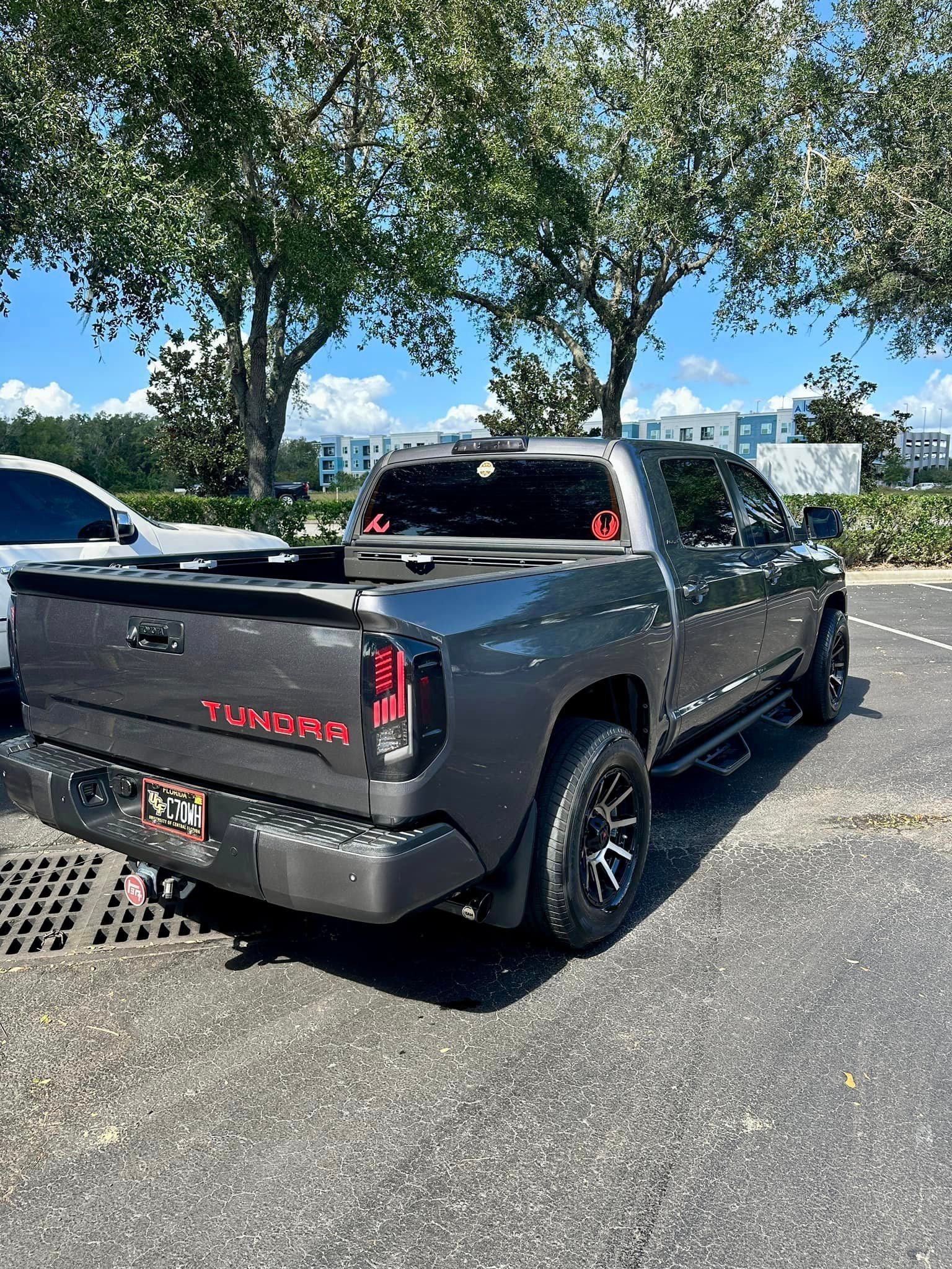 A toyota tundra is parked in a parking lot.