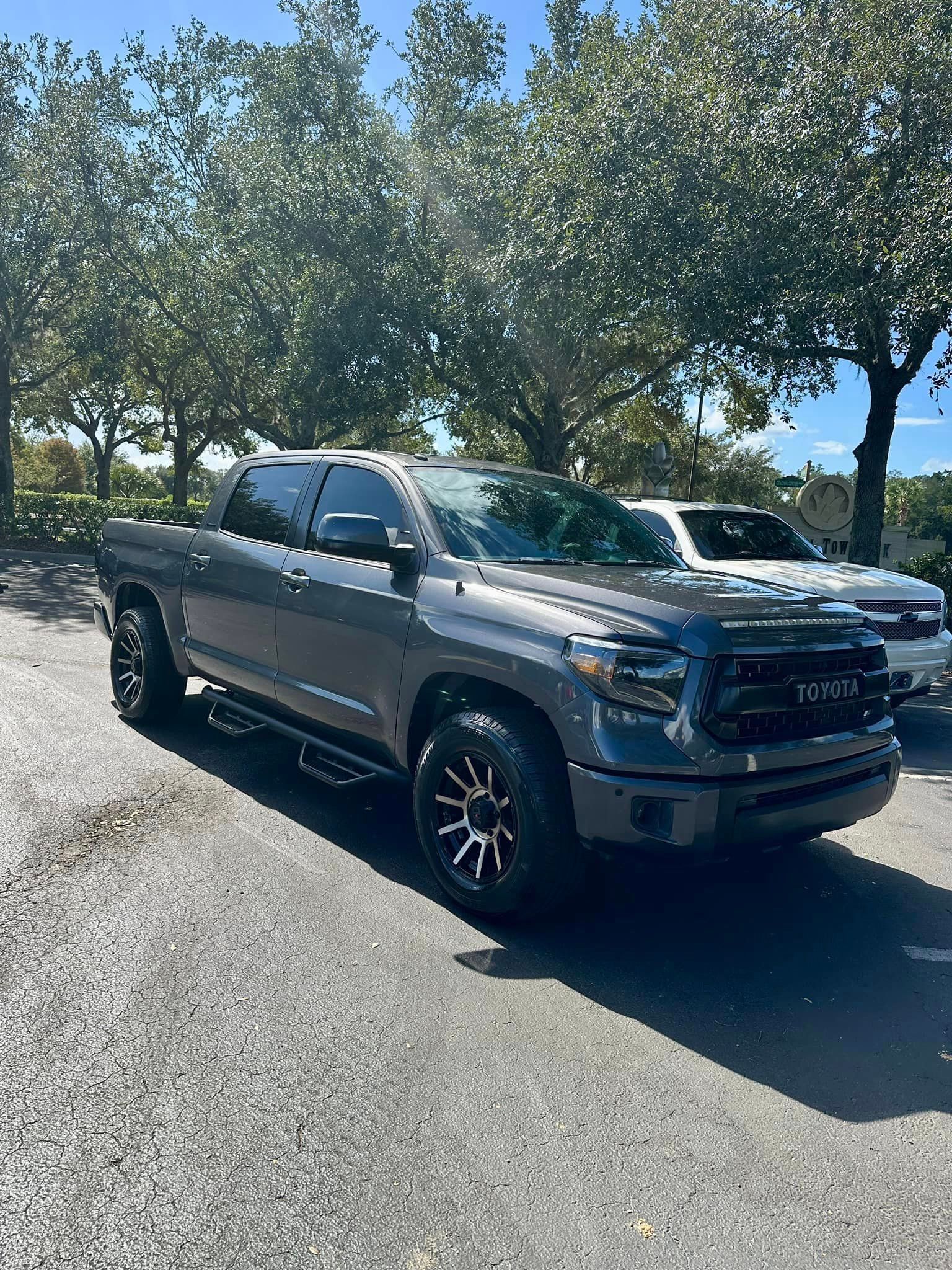 A toyota tundra is parked in a parking lot.