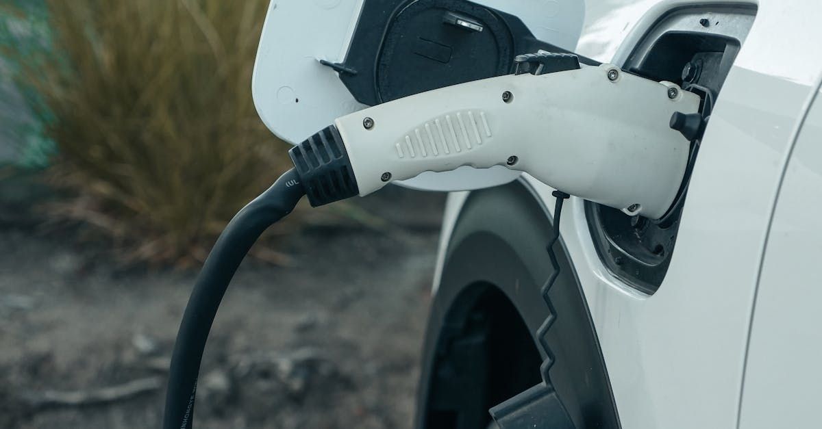 An electric car is being charged at a charging station.