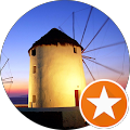 A windmill in a circle with an orange star in the middle.