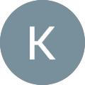 The letter k is in a blue circle on a white background.
